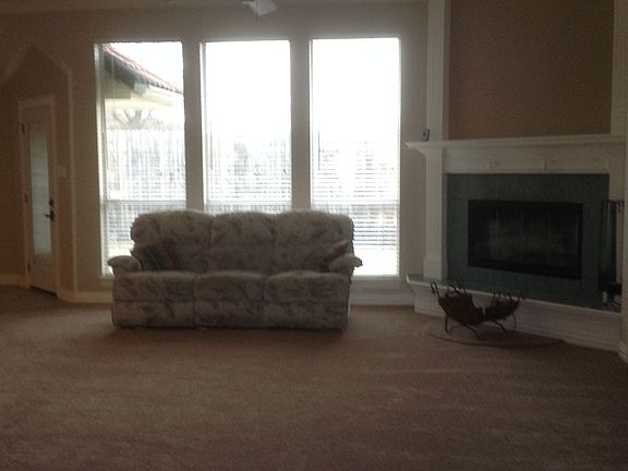 Large Living Room with wood-burning fireplace, floor-to-ceil