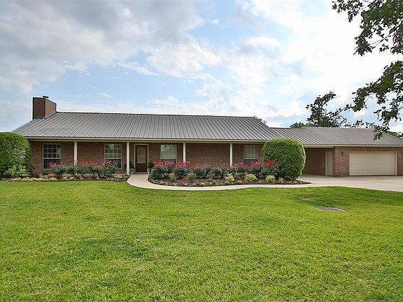 Move in ready one story 4 Bedroom 2 1/2 Bath with manicured grounds.