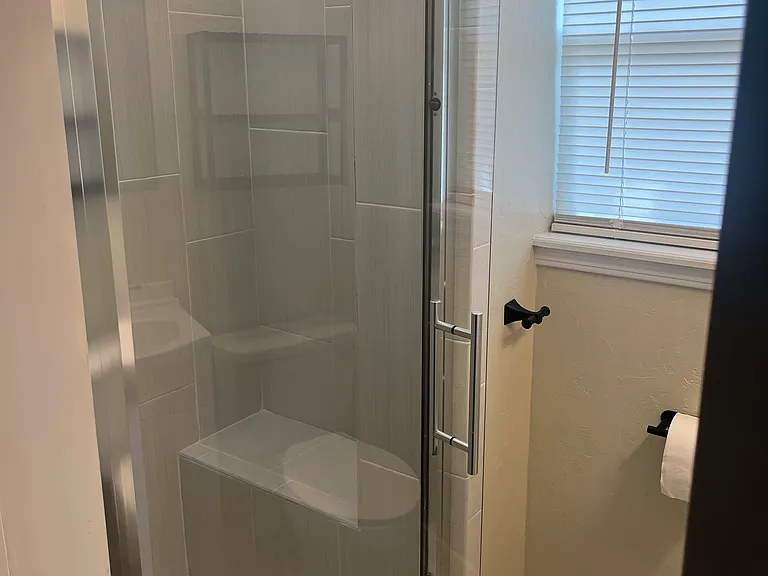 Master bath has nice finishes and blue-tooth connected exhaust fan for music in the shower