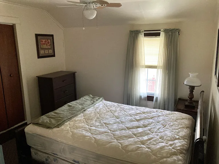 Bedroom full bed and dresser