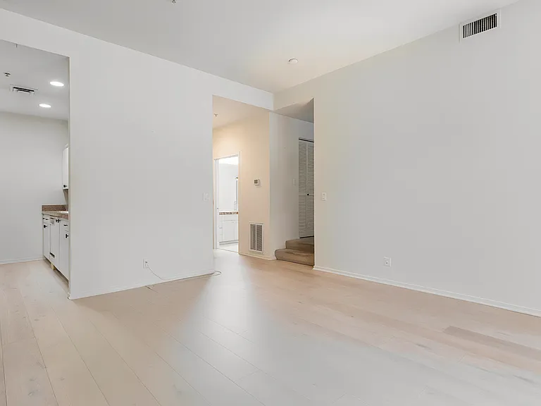 Living area. Stairs to open office/guest space.
