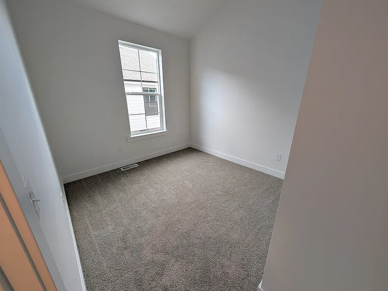 Bedroom 2. Nice vaulted ceilings and great closet space.