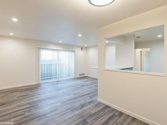 Dining room & family room with patio door.