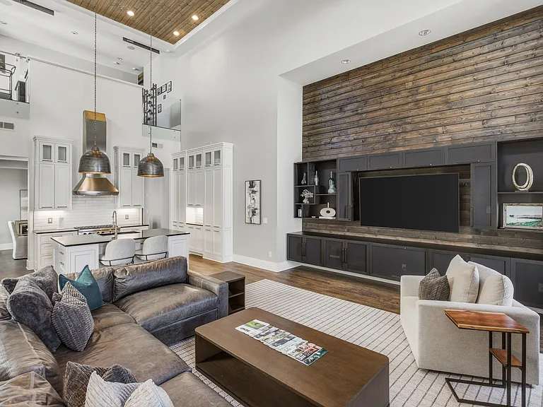 Bright, modern living room with HUGE ceilings. Abundant natural light, plush seating for everyone, a cozy gas fireplace, and a Smart TV_perfect for relaxing.