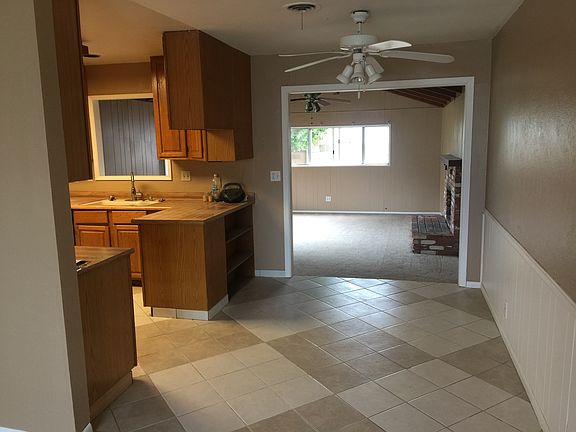 dining room part of kitchen and back bonus room with firepla