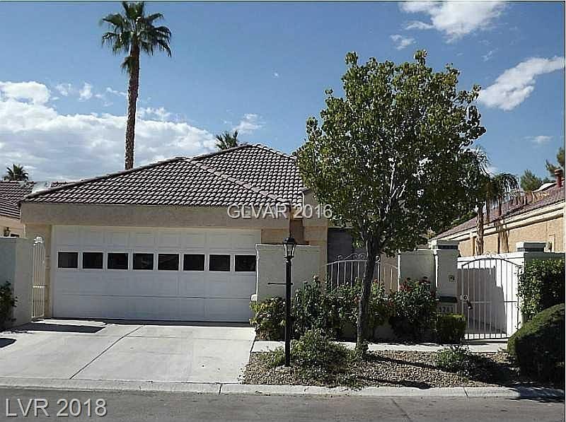Gated courtyard entry with 2 car garage. Off to the left of the garage is a storage area for bicycles, garbage cans etc .