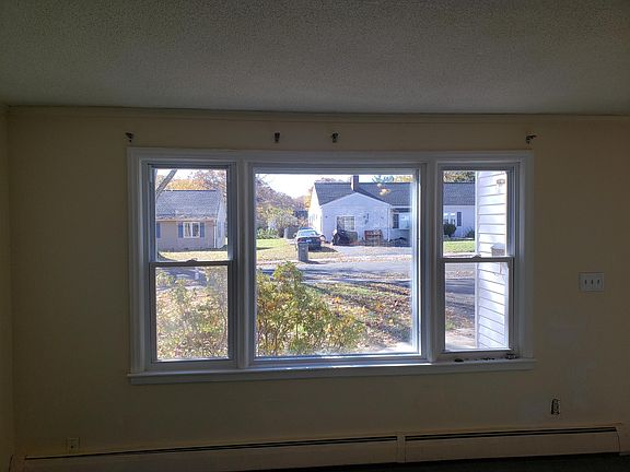 There is a nice picture window in the living room looking out on Weaver Road.