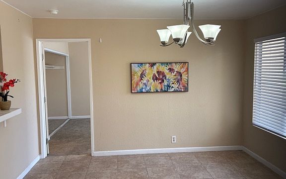 Tiled living room and dining area.
Np popcorn.