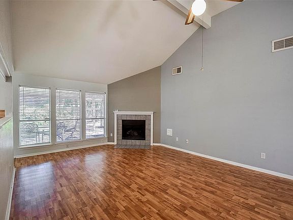 The bank of windows overlooks the covered deck and back yard and lets in the daytime.