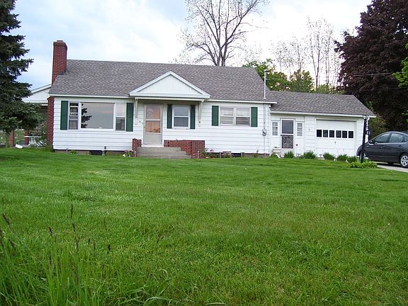 Before new windows, siding, doors.