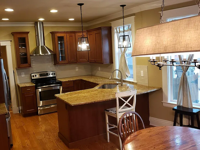 Granite countertops with breakfast bar.