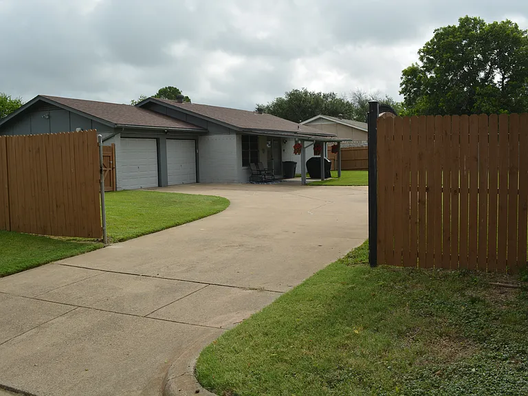 Enjoy our large driveway to fit multiple cars with-in the gated area.