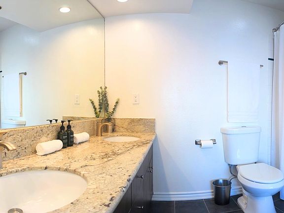 Master Bathroom with Dual Sink, wall-to-wall mirror, and great lighting.
