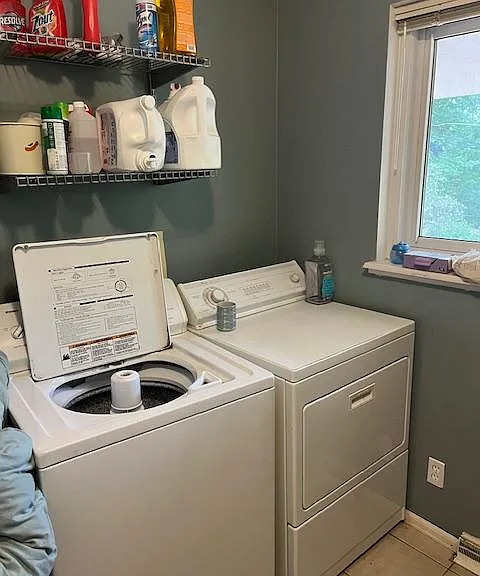 Laundry room just off the open area near the French doors to outside.