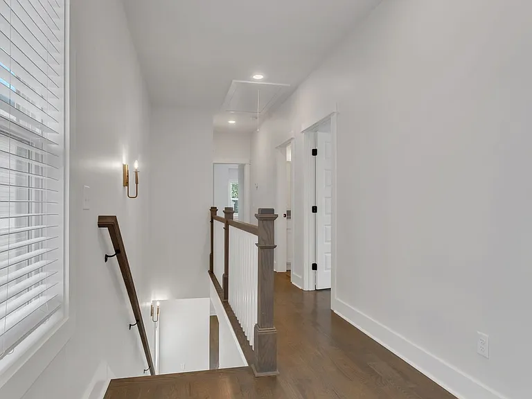 Top of stairs. Laundry room directly to right. Bedroom #2 (or bonus room) directly behind.