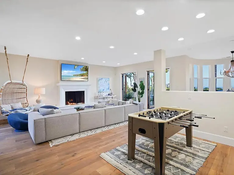Featuring a foosball and pool table for additional entertainment.