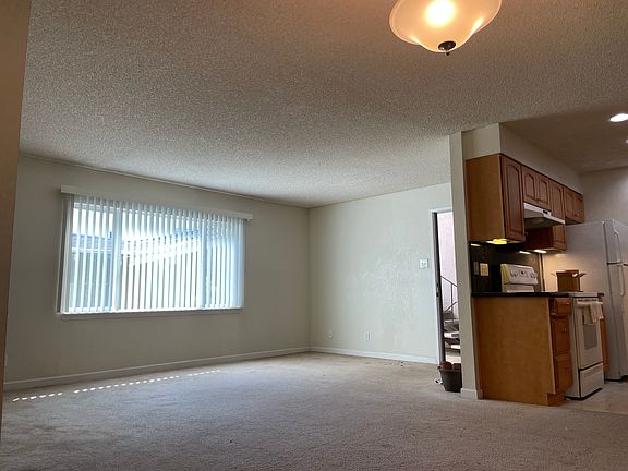 View 3 of the large Living Space from the Dining Room. Kitchen is to the right of picture.