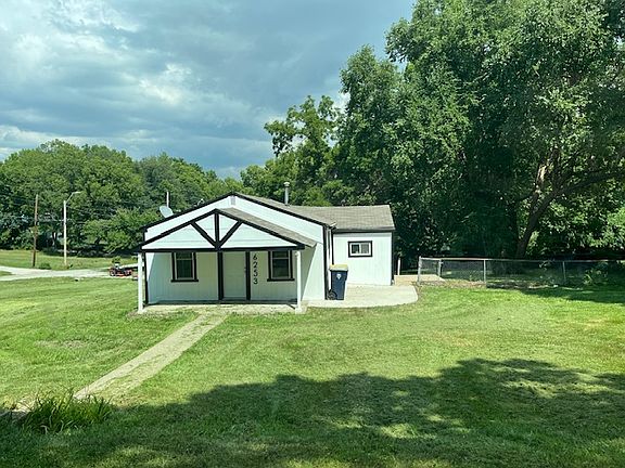 Huge yard, right side is fenced in, new patio where trash can is located, perfect for a table and chairs