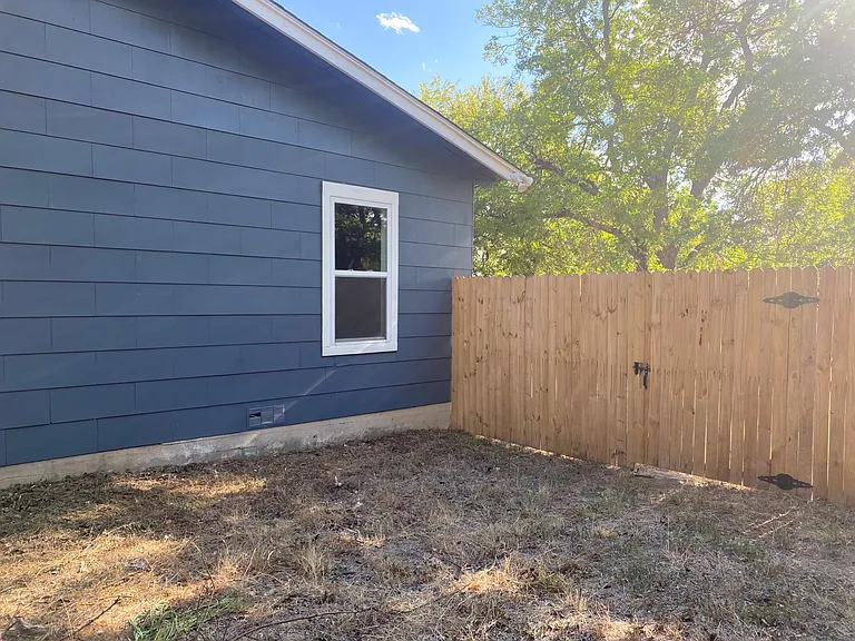 Side yard including new fence section