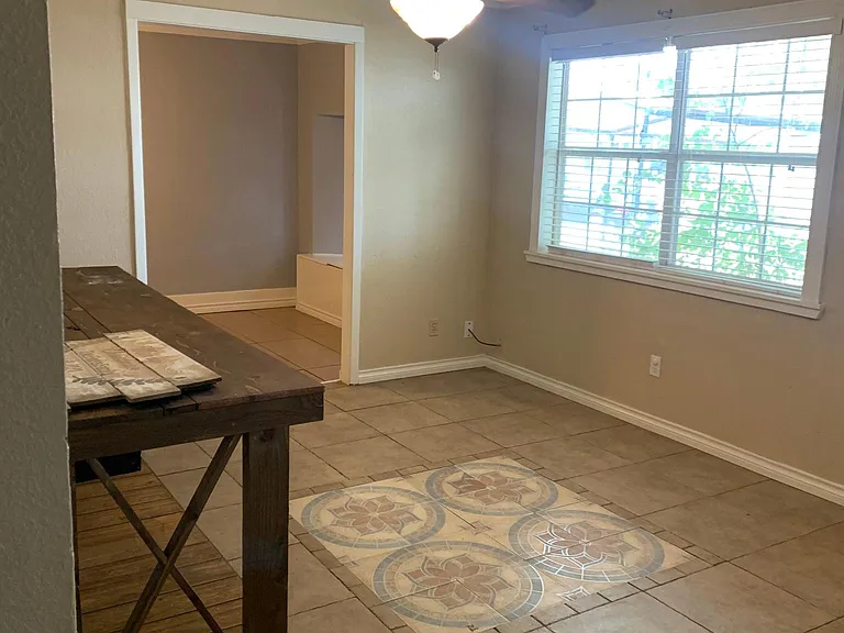Living room, the opening on the far wall is the entrance to the bonus room