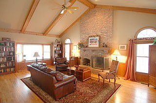 Family room with bay window/ views of backyard woods 