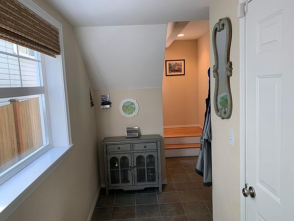 Foyer with tile floor. Door opens into garage