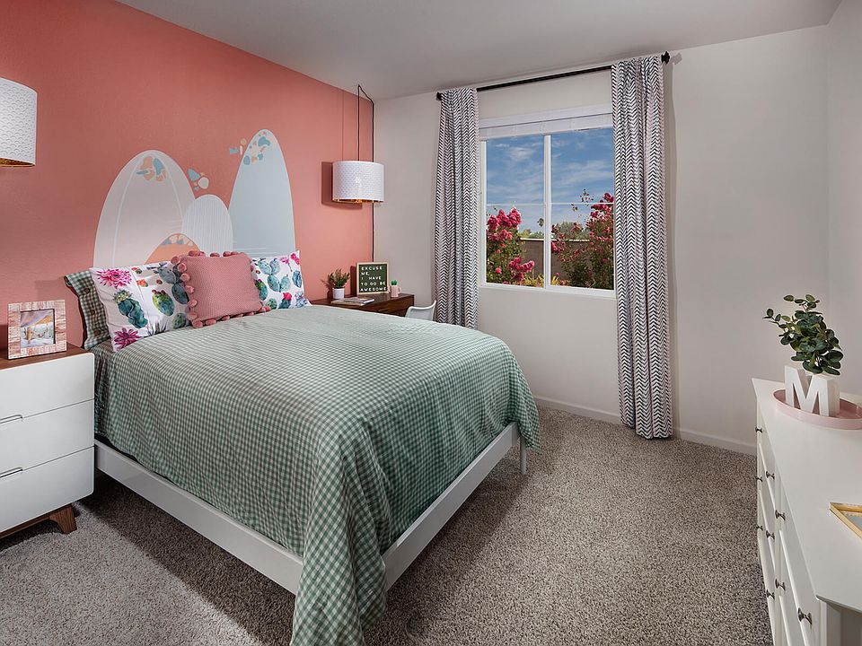 Residence 2 secondary bedroom modeled at a nearby Meritage community.