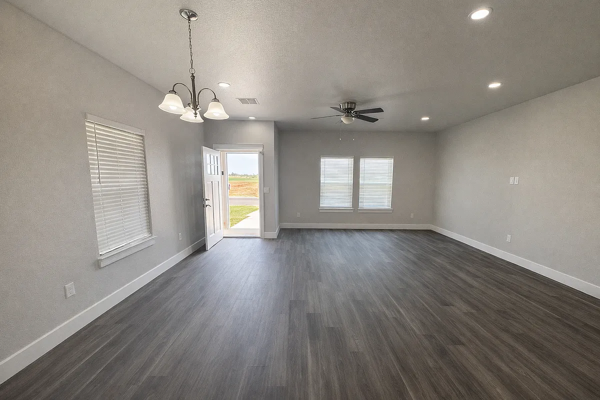 Spacious living area with 9-foot ceilings and abundant natural light. - 695 Worth Ave