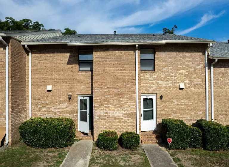 Welcome to Courtyards Apartments, where comfort meets convenience. Our charming brick exteriors and inviting doors create a warm community atmosphere. Explore spacious living options and modern amenities. Schedule your visit today for a personal tour!