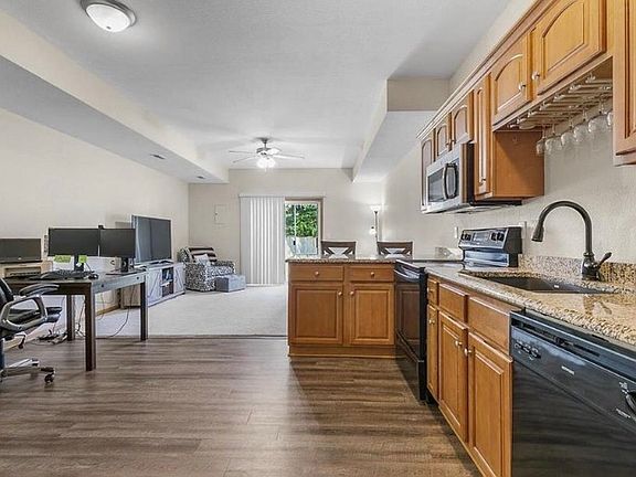 Open concept living, dining and kitchen area.