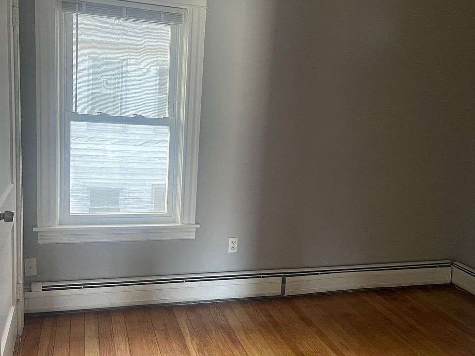 Freshly painted bedroom with refinished floors