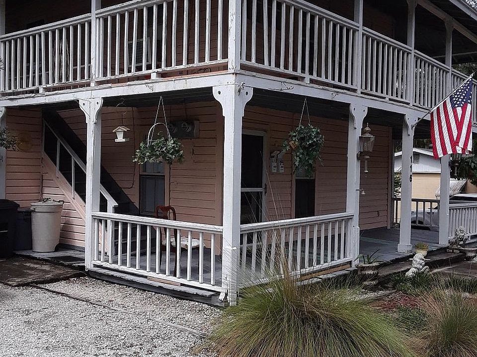 Parking next to side of house with stairs