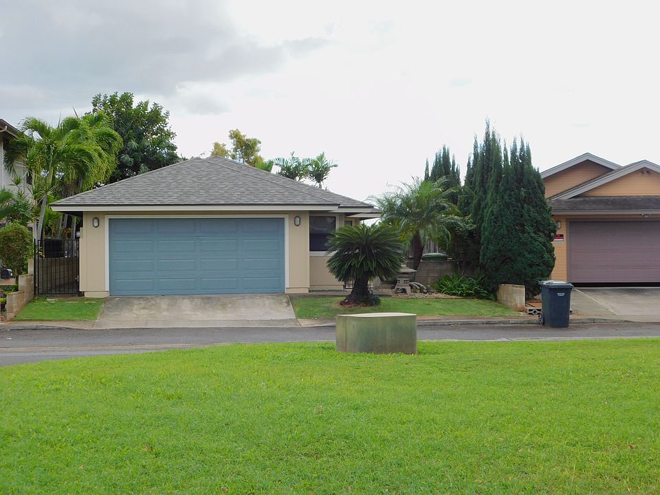 Front of house faces a green belt.