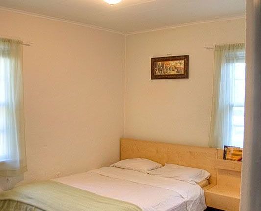 Two nice size bedrooms with hardwood floors, new paint and lighting.