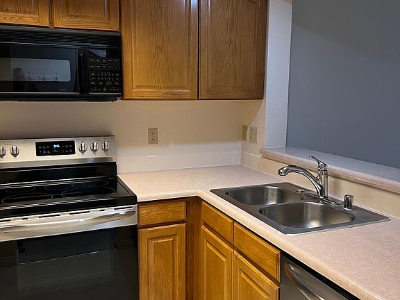Open concept kitchen with double bowl sink and upgraded pull out faucet