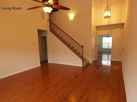 1/2 bath off the den, upgraded stair rail, neutral-tone walls