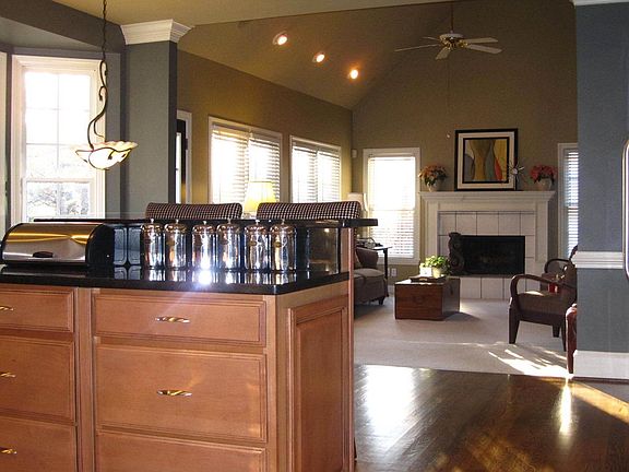 The Chef's Kitchen Opens Up to the FIRESIDE FAMILY ROOM!