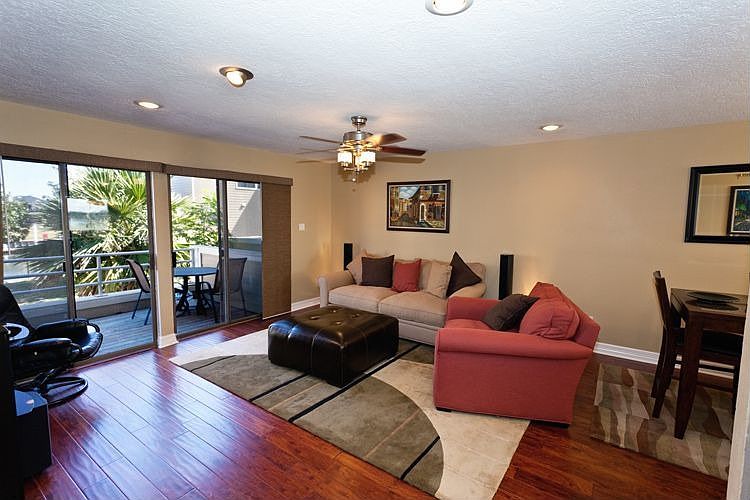 The Den features hardwood flooring, updated lighting & spectacular water view