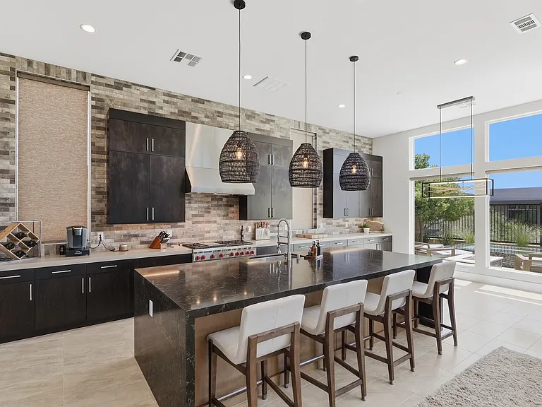 #GuardianRealty 10941 Earth Hues Summerlin Luxury Home Rental kitchen breakfast bar_06232026