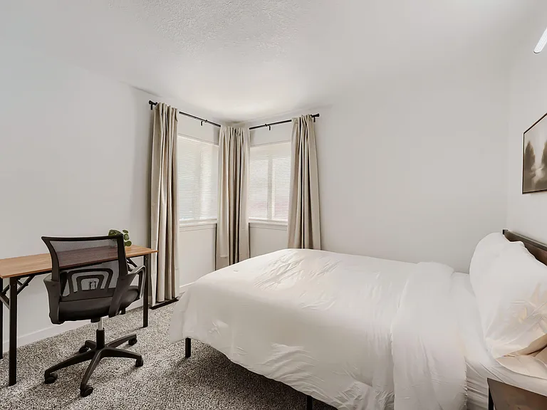 Plenty of natural light and includes bed linens, towel, shower caddy and blackout curtains.