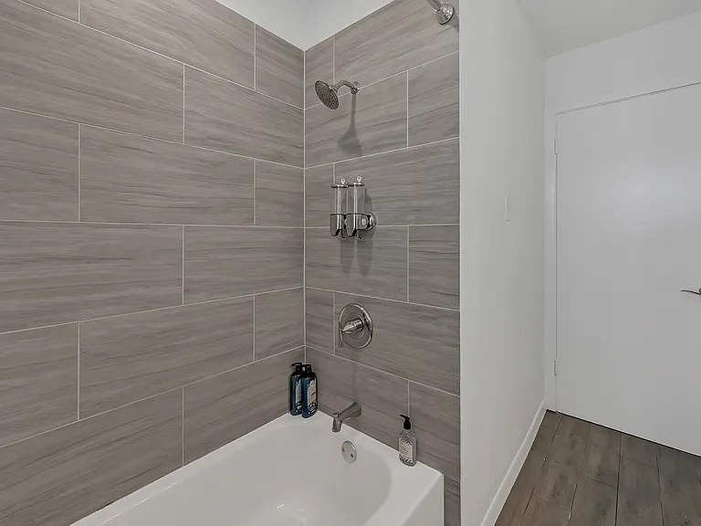 Guest bathroom with a full tub and shower