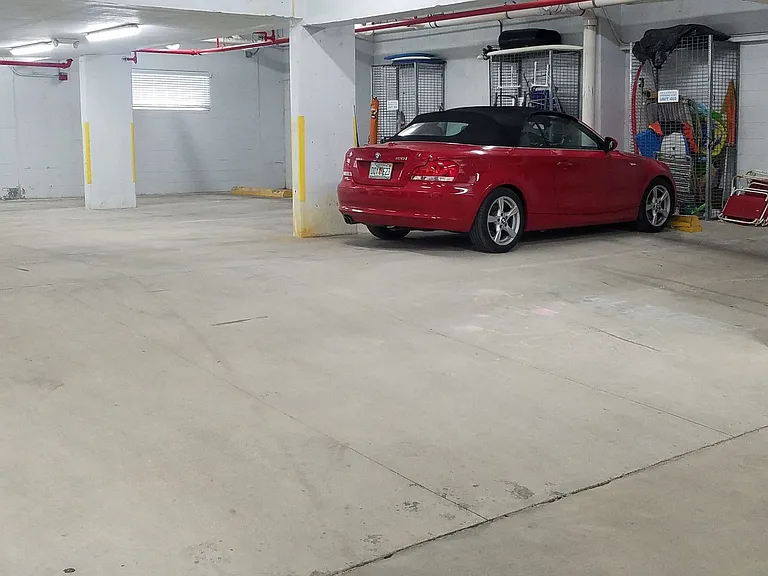 Indoor garage with one reserved parking spot