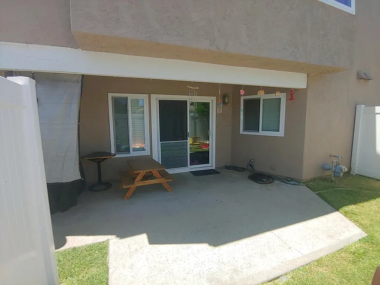 private backyard is fenced and grass has auto irrigation