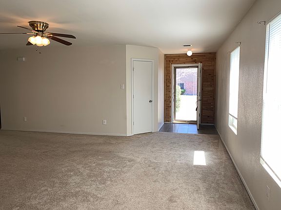 Large living room looking back at front door.