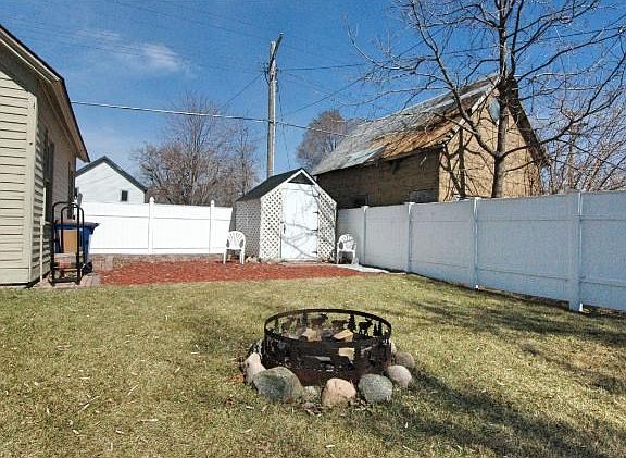 The cute little shed can be used for gardening or a playhouse for kids.