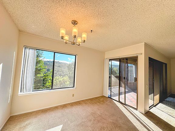 Dining room with views and access to balcony