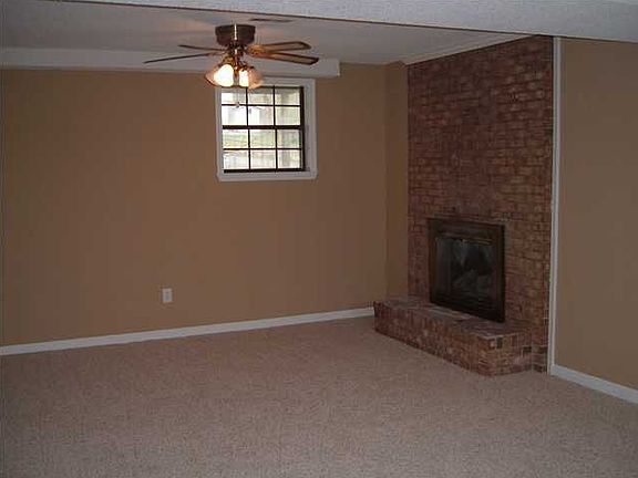 oversized den with new carpet and paint