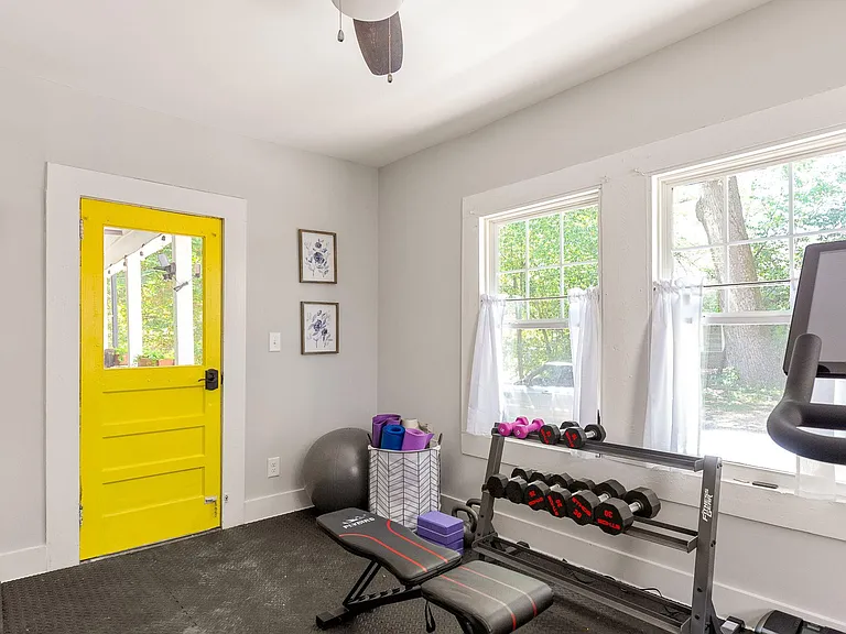 Private gym with Peleton bike, weights, yoga equipment; perfect for bike storage