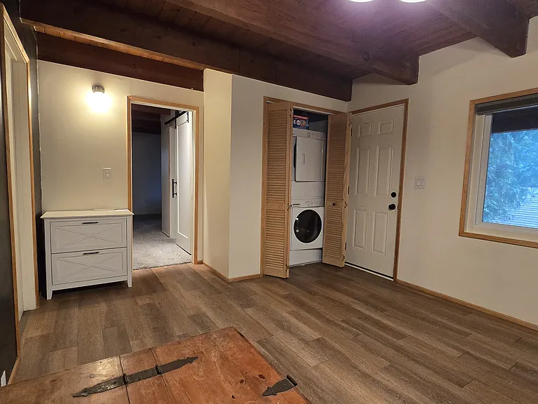 Downstairs 2nd Living area w/access to backyard and Laundry closet