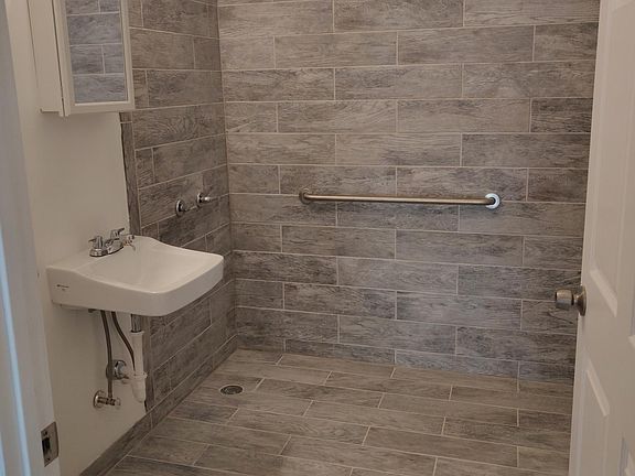 Easily assessible tiled shower.